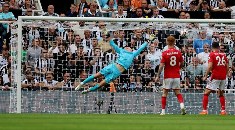 Newcastle's Callum Wilson scores their second goal past Forest's Dean Henderson. Action Images