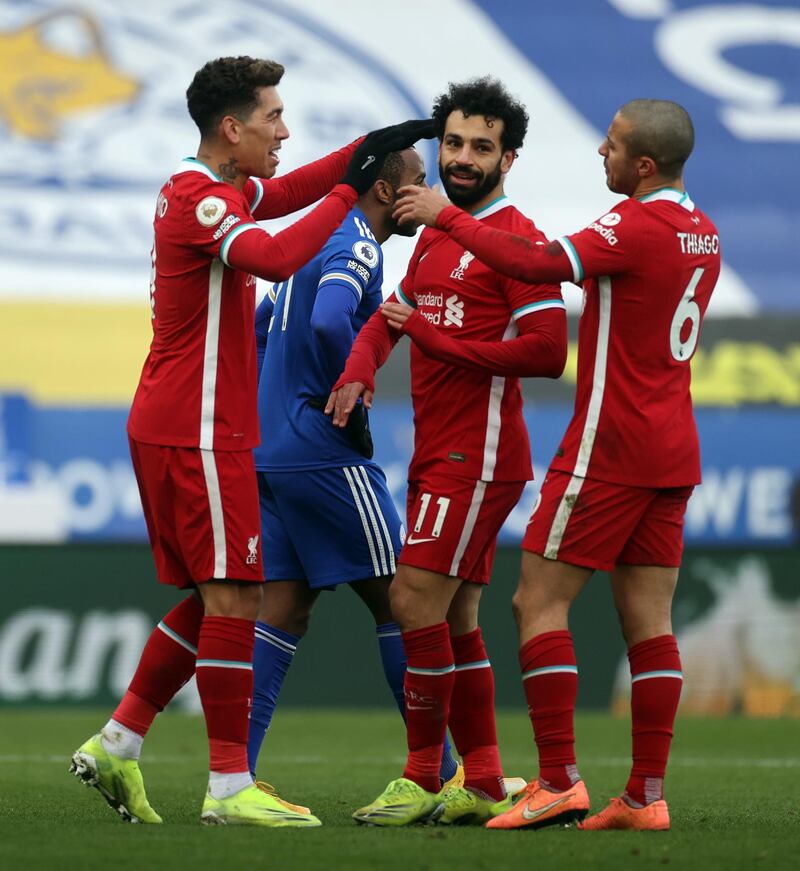 Liverpool's Mohamed Salah celebrates scoring the opening goal with Thiago Alcantara and Roberto Firmino. PA