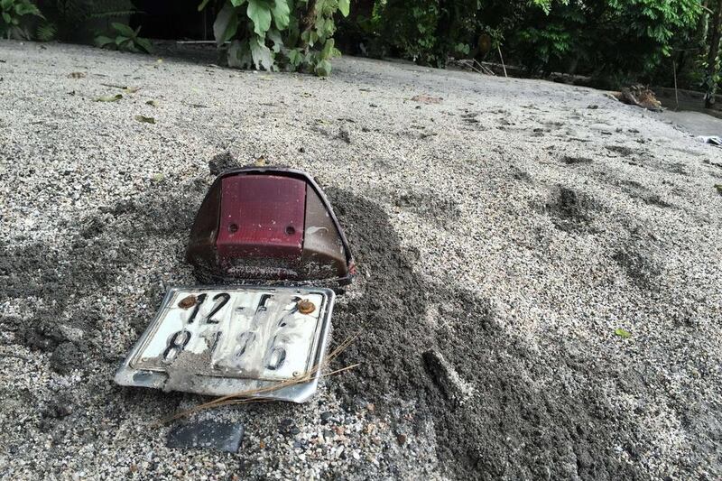 A motorcycle is buried in thick mud next to the Mong Duong coal mine following heavy rains in the northern coastal province of Quang Ninh, Vietnam. Hoang Dinh Nam / AFP Photo