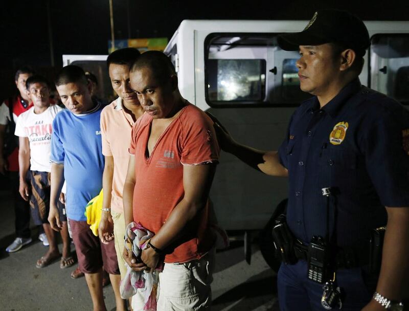 Alleged Filipino drug users and drug pushers arrested by the Philippine police during a night time raid on a suspected drug den in Manila, Philippine on June 28, 2016. Francis R Malasig/EPA