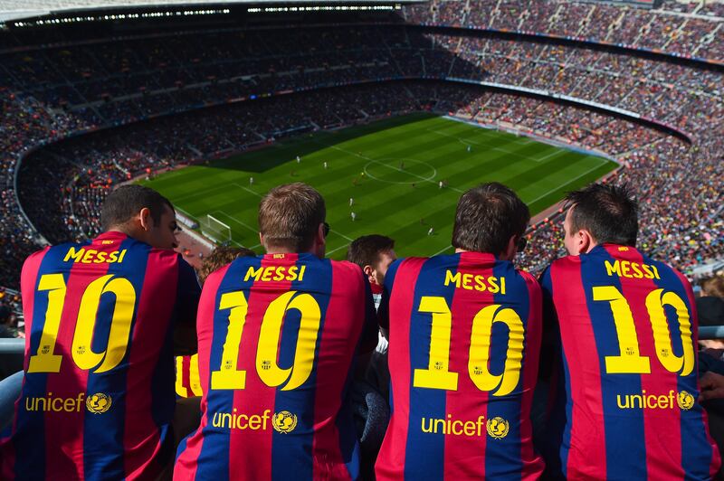 Barcelona supporters wearing Lionel Messi shirts watch the game from the stands during the Liga match between Barcelona and Rayo Vallecano at Camp Nou on March 8, 2015 in Barcelona, Spain. Getty Images