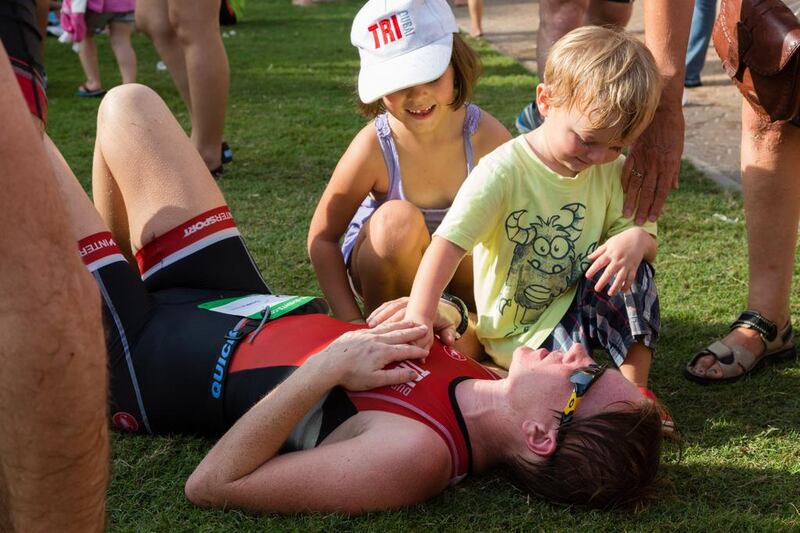 Bekky Britain catches her breath with her two children after comnpetiting in the Roy Nasr Memorial Triathlon at Jebel Ali Golf Resort. Duncan Chard for the National