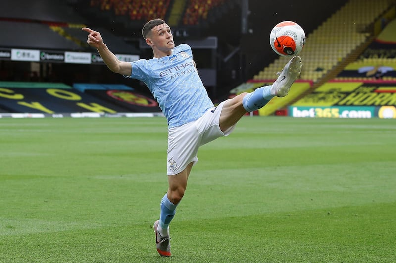 Manchester City's English midfielder Phil Foden controls the ball at Vicarage Road. AFP