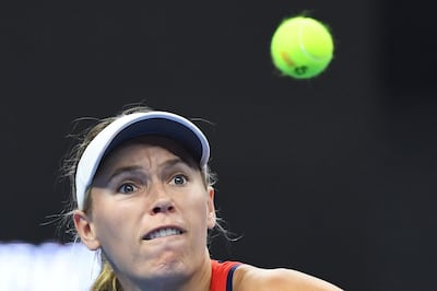 Caroline Wozniacki of Denmark watches the ball during her women's singles first round match against Belinda Bencic of Switzerland at the China Open tennis tournament in Beijing on October 1, 2018.   / AFP / GREG BAKER

