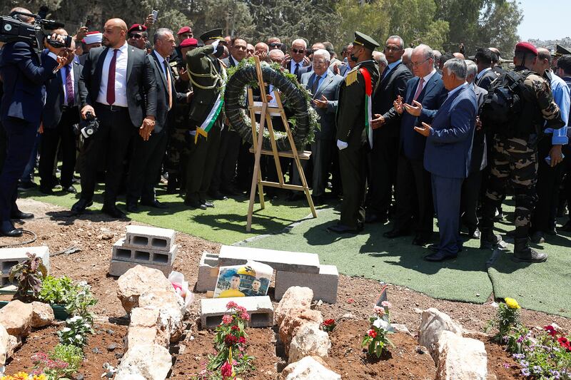 Palestinian President Mahmoud Abbas and Prime Minister Mohammad Shtayyeh visit graves of Palestinians killed by Israeli forces in a recent Israeli raid in Jenin. Reuters
