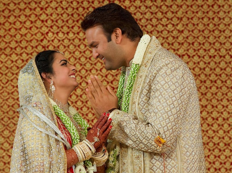 Bride Isha Ambani, the daughter of the Chairman of Reliance Industries Mukesh Ambani, and her groom Anand Piramal, heir to a real-estate and pharmaceutical business, after they got married in Mumbai, India, December 12, 2018. Reliance Industries/Handout via REUTERS  ATTENTION EDITORS - THIS IMAGE WAS PROVIDED BY A THIRD PARTY. NO RESALES. NO ARCHIVE.