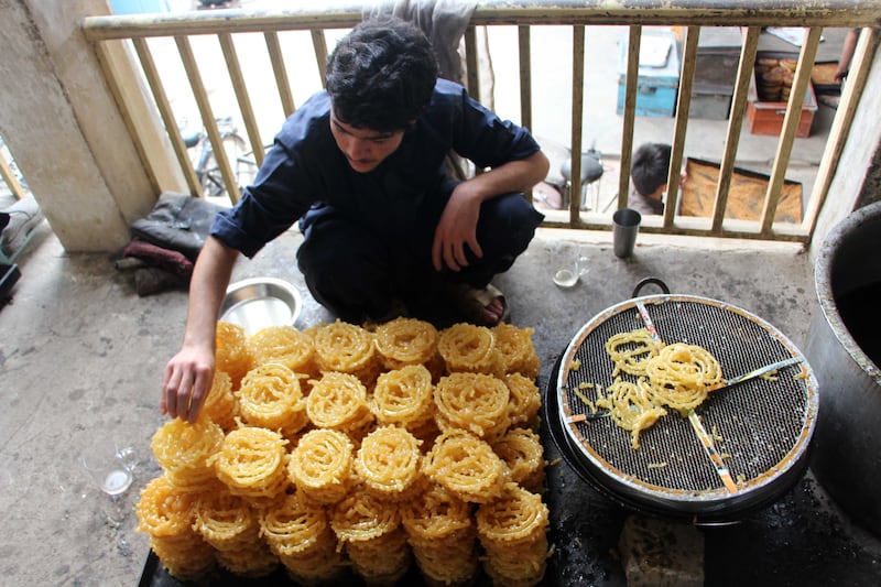 Traditional sweets are prepared ahead of Ramadan, in Kandahar, Afghanistan. EPA