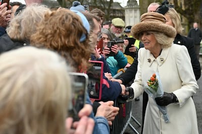 Queen Camilla meets well-wishers after attending the Royal Maundy Service. AP