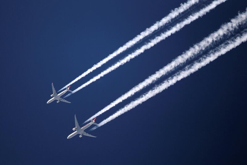 LONDON, ENGLAND - MARCH 12:  Two commercial airliners appear to fly close together as the pass over London on March 12, 2012 in London, England.  (Photo by Dan Kitwood/Getty Images)