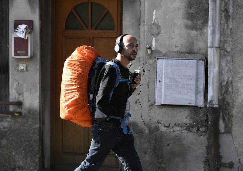 Abdelghani Merah, the elder brother of Mohamed Merah who murdered seven people in southwestern France in 2012, walks along the country's major N7 road on February 16, 2017 as part of a personal campaign to combat extremism. Philippe Desmazes / AFP Photo