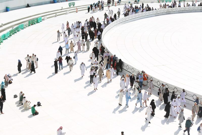 Muslim worshippers circumambulate the sacred Kaaba in Mecca's Grand Mosque, Islam's holiest site, on March 7, 2020. Saudi Arabia reopened today the area around the sacred Kaaba, reversing one of a series of measures introduced to combat the coronavirus outbreak. Saudi authorities this week suspended the year-round umrah pilgrimage, during which worshippers circle the Kaaba seven times, and also announced the temporary closure of the area around the cube structure.
 / AFP / Abdel Ghani BASHIR
