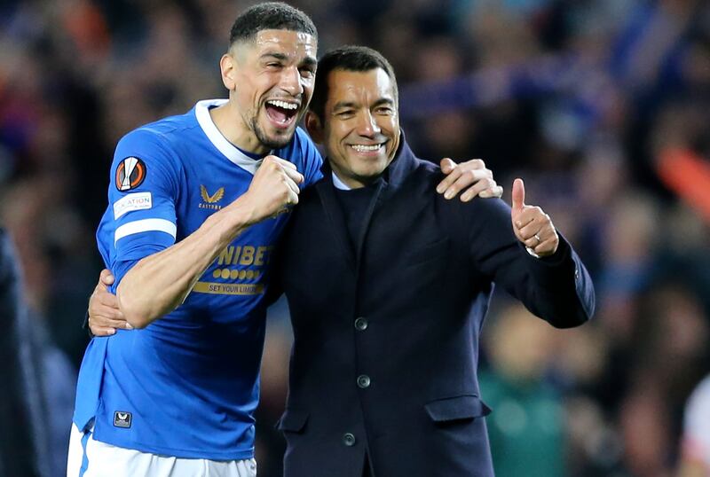 Rangers manager Giovanni van Bronckhorst and James Tavernier celebrate after beating RB Leipzig 3-2 on aggregate in the Uefa Europa League semi-final, second leg at Ibrox on May 5, 2022. EPA