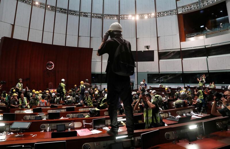 Protesters are seen inside a chamber after they broke into the Legislative Council building. Reuters