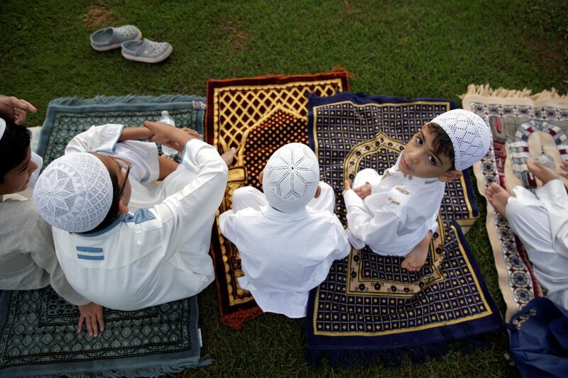 Men and children take part in the Eid Al Fitr prayers in Panama City, Panama.