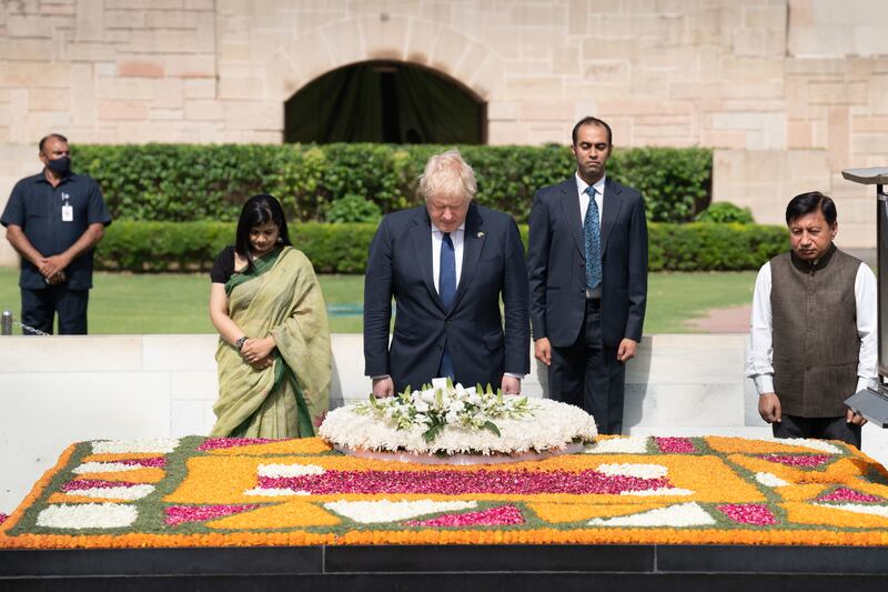 Boris Johnson pays his respects at Mahatma Gandhi's memorial. Getty Images