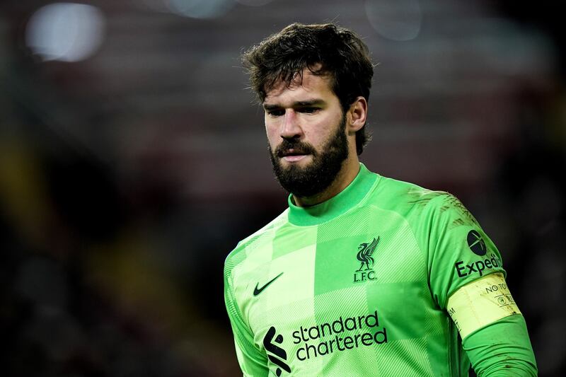 LIVERPOOL RATINGS: Alisson Becker - 6: The Brazilian was not unduly troubled but made one howler of a pass that allowed Porto a chance. Otherwise his distribution was fine. EPA