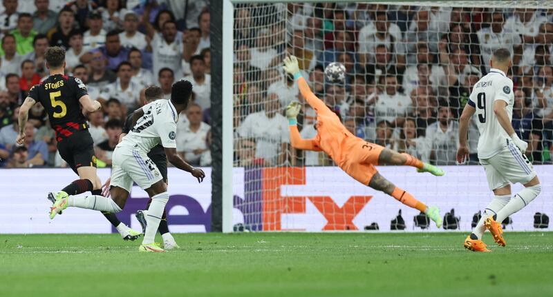 Real Madrid's Vinicius Junior scores the first goal. Reuters