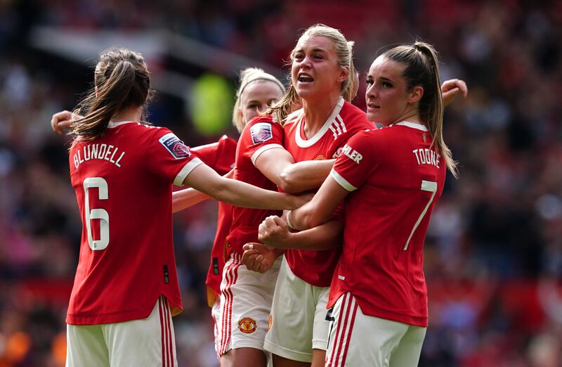 Russo, centre, celebrates after scoring. PA