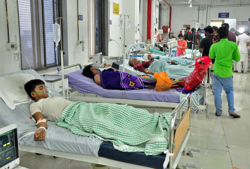 Workers of a dyeing and printing mill receive treatment in a hospital after they inhaled toxic gas, in Surat, India. Reuters