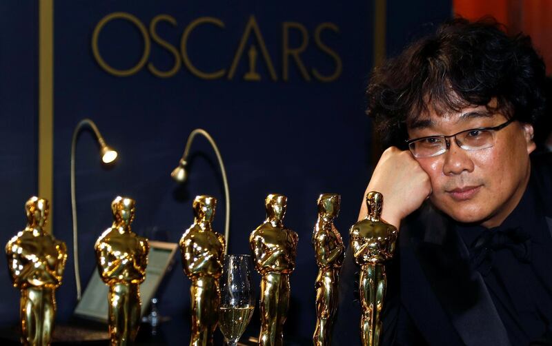 Bong Joon-ho poses with the Oscars for "Parasite" at the Governors Ball after the Oscars on Sunday, February 9, 2020, at the Dolby Theatre in Los Angeles. Reuters