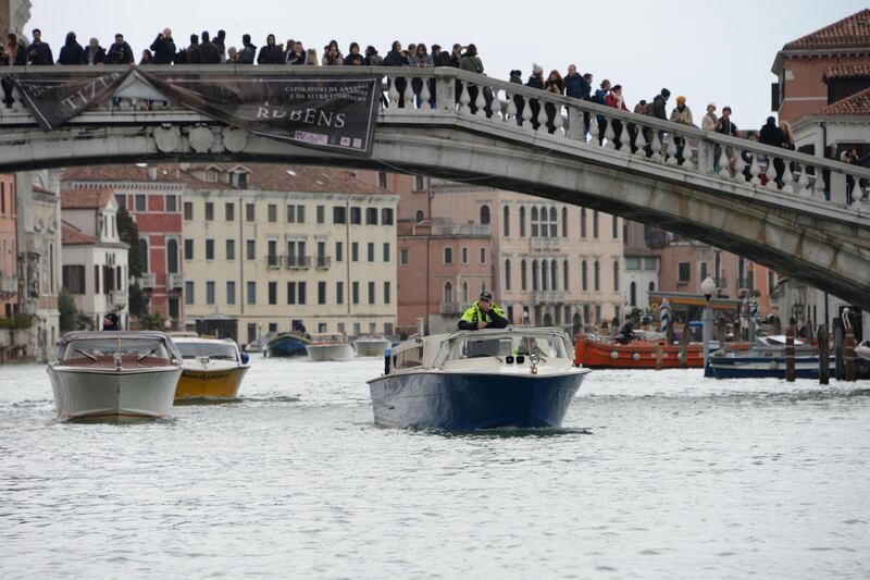 epa07999392 Vaporettos on the Grand Canal during high water in Venice, northern Italy, 15 November 2019. Venice closed St Mark's Square due to fresh flooding in the city. The city is currently suffering its second-worst floods on record, with the high-water mark reaching 187cm on Tuesday. The water level had dropped down significantly but it is forecast to go back up to 160cm today.  EPA/ANDREA MEROLA