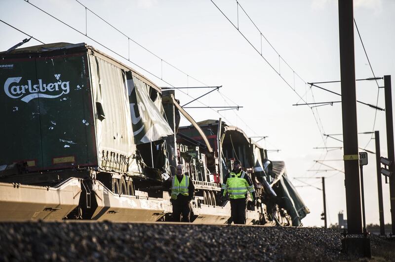 epa07257994 A damaged freight train stands at the Great Belt Bridge in Nyborg, Denmark, 02 January 2019, after a train accident. Trail transport operator DSB announced that six people have died in the accident.  EPA/TIM K. JENSEN  DENMARK OUT
