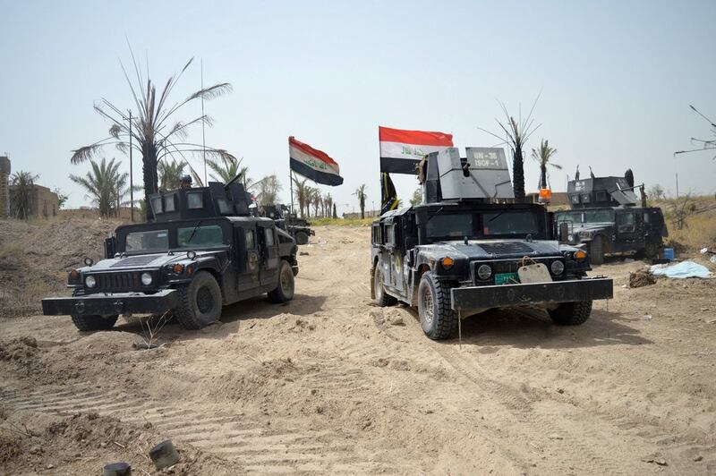 Iraqi security forces vehicles drive through Shuhadaa neighborhood in Fallujah, Iraq. Photo: Reuters