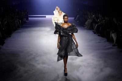 Models present creations by Ashi Studio at Paris Haute Couture Week. AFP