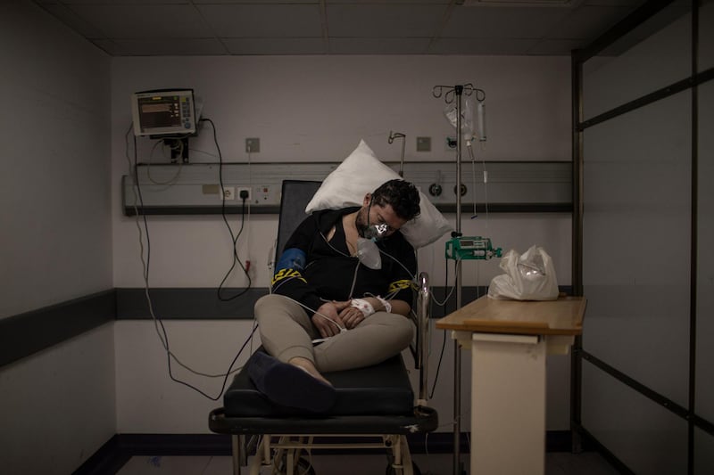 A Lebanese person sleeps inside a room for COVID-19 patients inside Rafik Hariri University Hospital, in southern Beirut, Lebanon. Getty Images