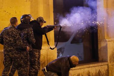 Riot police fire rubber bullets towards anti-government protesters trying to enter a square in central Beirut. AP