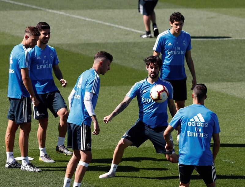 Real Madrid midfielder Isco, centre, takes part in a training session. EPA
