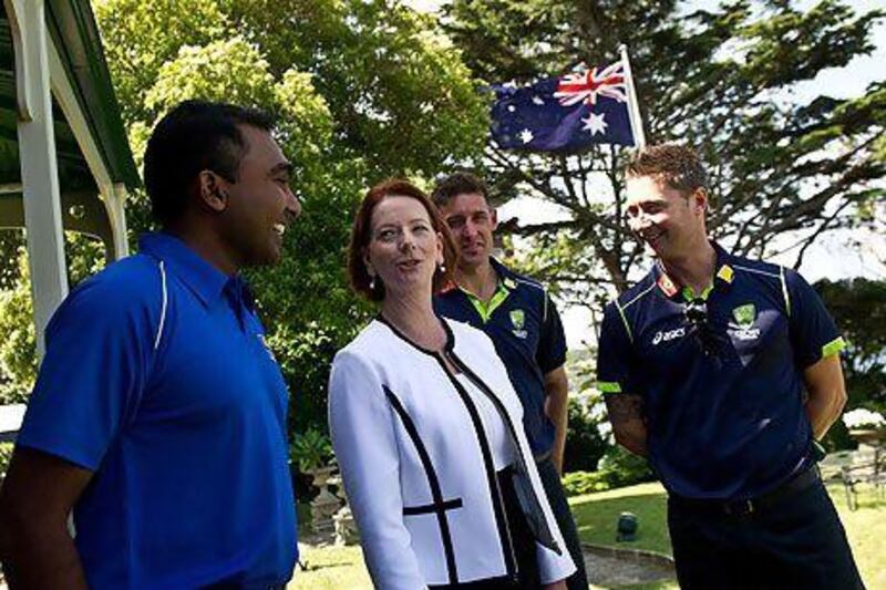 Australia's prime minister Julia Gillard, second from left, speaks with Australia cricket captain Michael Clarke, right, and Sri Lankan captain Mahela Jayawardene, left, as Australia cricketer Mike Hussey looks on during an afternoon tea at Kirribilli House in Sydney. Manan Vatsyayana / AFP