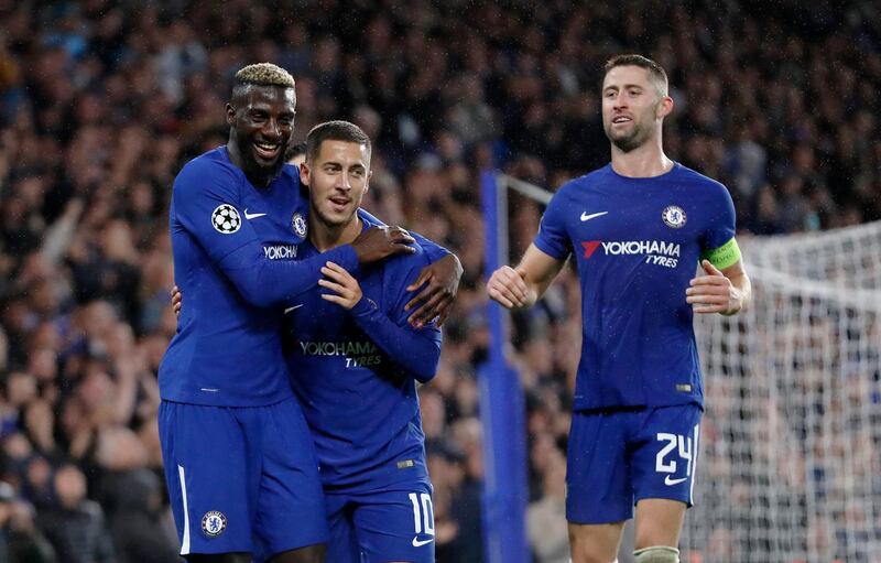 Chelsea's Tiemoue Bakayoko, left, celebrates with his teammates Eden Hazard, center, and Gary Cahill after scoring during the Champions League group C soccer match between Chelsea and Qarabag at Stamford Bridge stadium in London, Tuesday, Sept. 12, 2017. (AP Photo/Kirsty Wigglesworth)