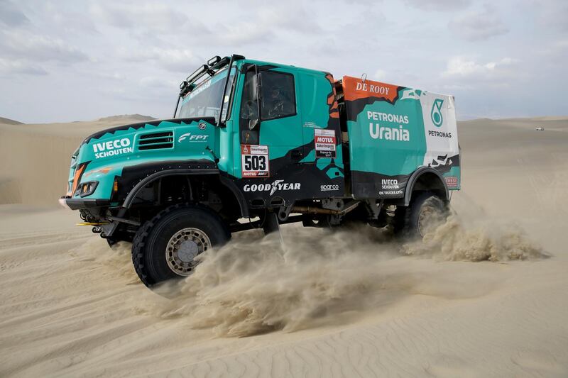 Driver Gerard De Rooy and co-drivers Darek Rodewald and Moises Torrallardona race their Iveco truck. AP Photo