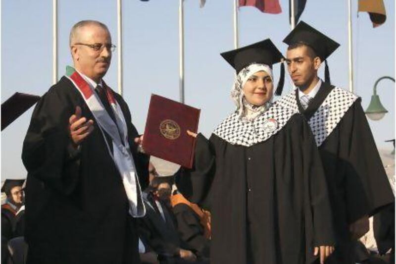 Rami Hamdallah, left, is the Palestinian Authority's new prime minister. Nasser Ishtayeh / AP Photo