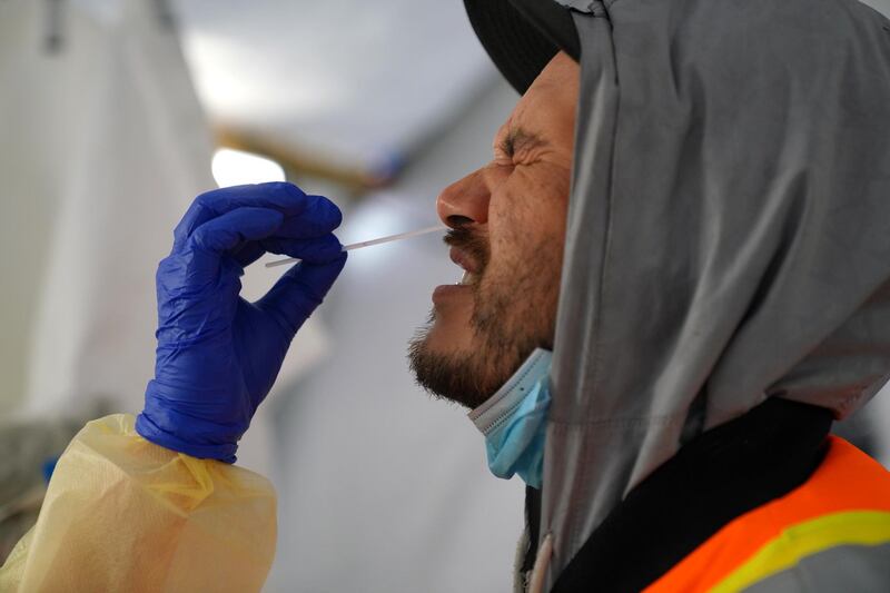 Provincial health workers perform coronavirus disease nasal swab tests on Raymond Robins of the remote First Nation community of Gull Bay, Ontario, Canada. Reuters