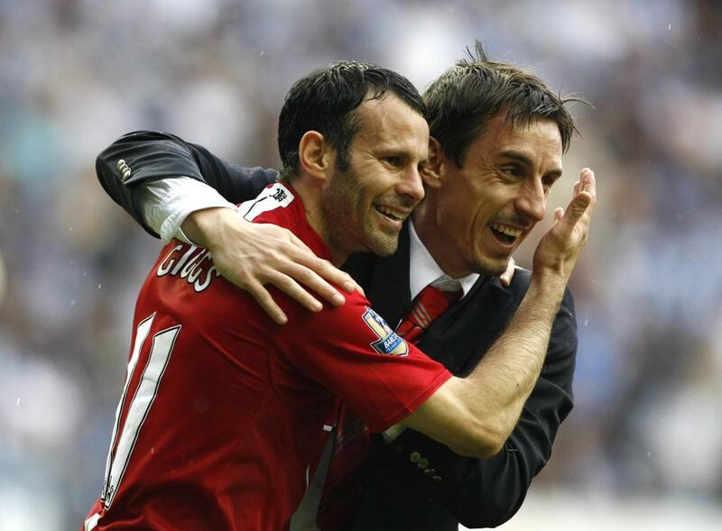 Giggs celebrates with Gary Neville after winning the Premier League in 2008. Reuters