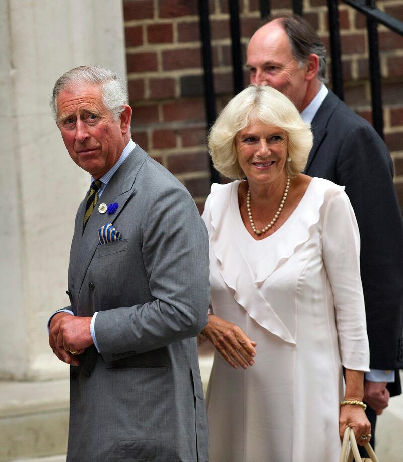 epa03798845 Britain's Prince Charles, Prince of Wales, (L) and his wife Camilla, Duchess of Cornwall, (R) leave St. Mary's hospital in London, Britain, 23 July 2013, after visiting the royal couple and their newborn baby boy. Thirty-one year old Catherine Duchess of Cambridge gave birth to her, and Prince William's, first child, at 4.24pm BST at the Lindo Wing of St. Mary's hospital on 22 July.  EPA/BOGDAN MARAN *** Local Caption ***  03798845.jpg