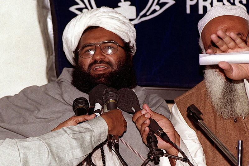 (FILES) In this photograph taken on February 4, 2000, Masood Azhar (L), chief of the Jaish-e-Mohammad (JeM), addresses a press conference in Karachi. For eight days in 1999 the world watched in horror as hijackers diverted an Indian Airlines flight to Afghanistan and held the passengers hostage, the drama ending only when Delhi agreed to release three Kashmiri militants. One of the militants freed was Masood Azhar, who later went on to found Jaish-e-Mohammad (JeM), the militant group which claimed responsibility in February 2019 for the deadliest attack in three decades in Indian-held Kashmir.  / AFP / Aamir QURESHI / TO GO WITH Pakistan-India-unrest-Kashmir, PROFILE by Gohar ABBAS with Parvaiz Bukhari

