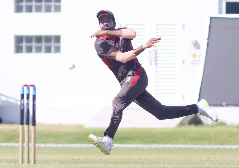 Zaward Farid of UAE attempts a throw at the wicket against Bahrain.