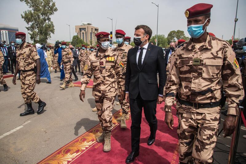 epa09155824 French President Emmanuel Macron (CR) arrives with the son of the late Chadian president Idriss Deby, Mahamat Idriss Deby (CL) to attend the state funeral for the late Chadian president Idriss Deby in N'Djamena, Chad, 23 April 2021. Chad's President Idriss Deby died of injuries suffered in clashes with rebels in the country's north, an army spokesperson announced on state television on 20 April 2021. Deby had been in power since 1990 and was re-elected for a sixth term in the 11 April 2021 elections.  EPA/CHRISTOPHE PETIT TESSON / POOL
