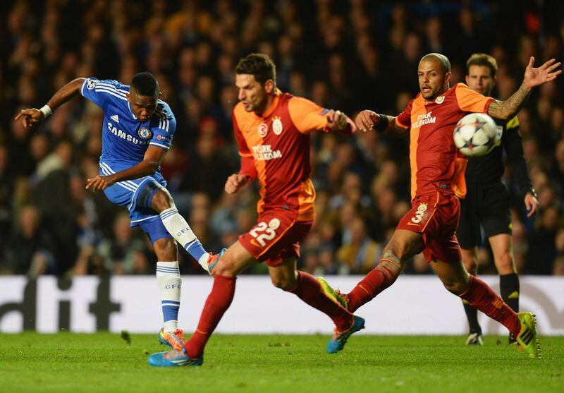LONDON, ENGLAND - MARCH 18:  Samuel Eto'o of Chelsea shoots past Hakan Balta (22) and Felipe Melo of Galatasaray during the UEFA Champions League Round of 16 second leg match between Chelsea and Galatasaray AS at Stamford Bridge on March 18, 2014 in London, England.  (Photo by Mike Hewitt/Getty Images)