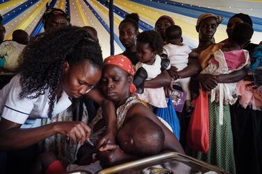 A child receives a malaria vaccine in Kenya. AFP