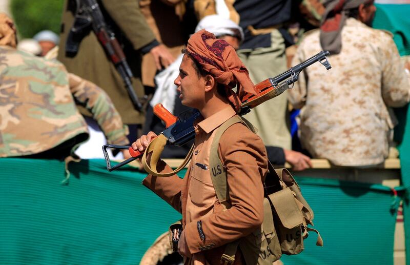 A fighter loyal to Yemen's Houthi rebels at the funeral of rebels killed in clashes with government troops. AFP