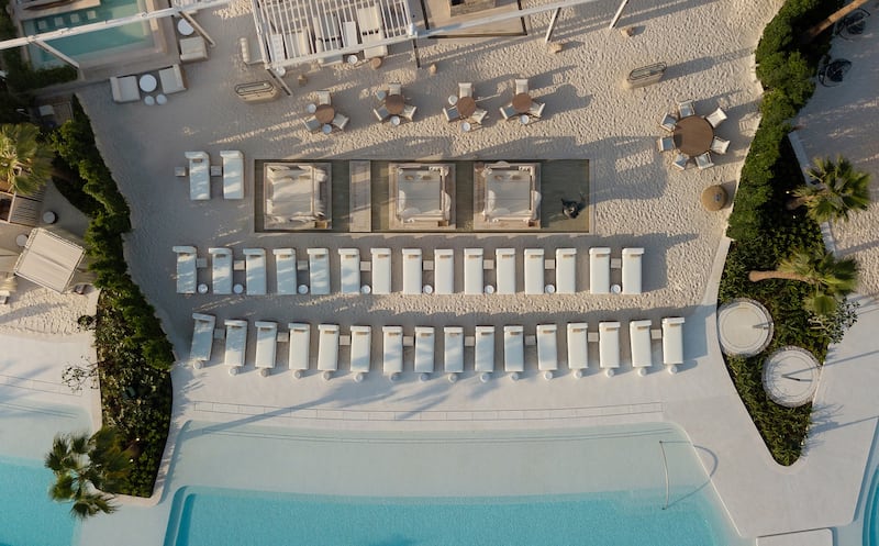 San Beach features in-pool loungers, a swim-up bar and chic cabanas. Photo: Nakheel