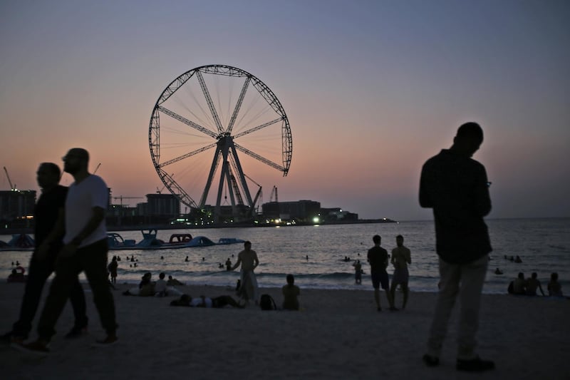 The sun sets behind the "Ain Dubai" or Dubai Eye, a 853 feet (260 meter) ferris wheel that is under construction, in Dubai, United Arab Emirates, Monday, Sept. 18, 2017. The ride is part of a $1.6 billion Bluewater Island project that belongs to Meraas, a state-owned Dubai-based holding company. (AP Photo/Kamran Jebreili)