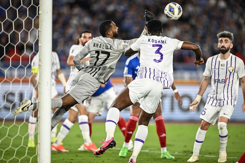 Ain's Emirati goalkeeper Khalid Eisa punches the ball clear. AFP