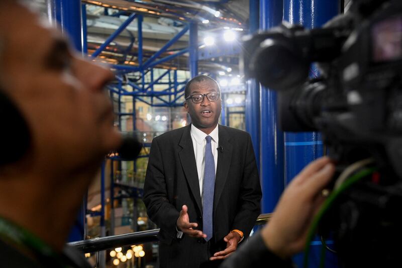 Mr Kwarteng gives a TV interview. Reuters