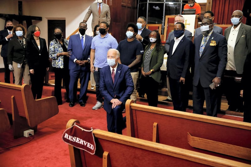 U.S. Democratic presidential candidate and former Vice President Joe Biden poses for a picture with Pastor of the Bethel AME Church, Rev. Dr. Silvester S. Beaman and attendees during a visit to the Bethel AME Church in Wilmington, Delaware, U.S. June 1, 2020. REUTERS/Jim Bourg     TPX IMAGES OF THE DAY
