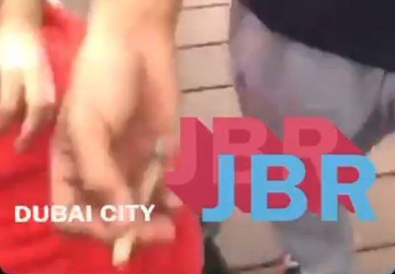 A screengrab from a video posted to social media showing three men pretending to smoke hashish at Jumeirah Beach Residence in Dubai.